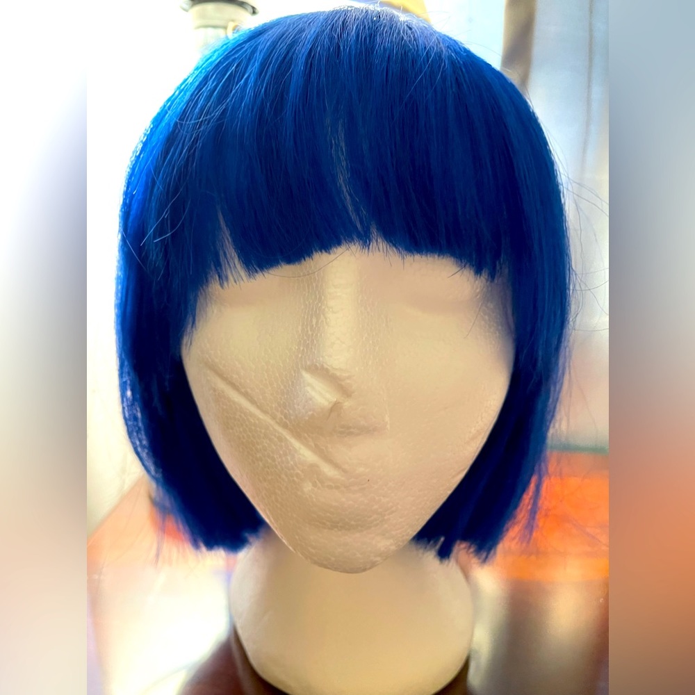 Wig. Bob style. Royal blue. Crown to tip appropriately 13”. Bangs.
